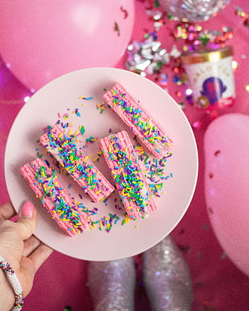 Bright, festive pink dessert with colorful sprinkles on a plate, perfect for birtays. HD phone wallpaper