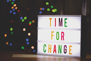 Colorful illuminated sign displaying the motivational message 'Time for Change'. HD wallpaper