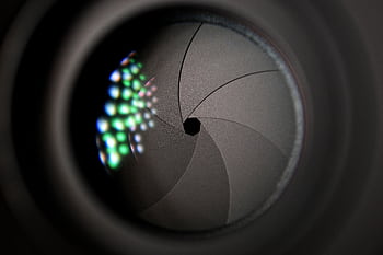 Detailed of a camera lens aperture showing mechanical blades. HD wallpaper