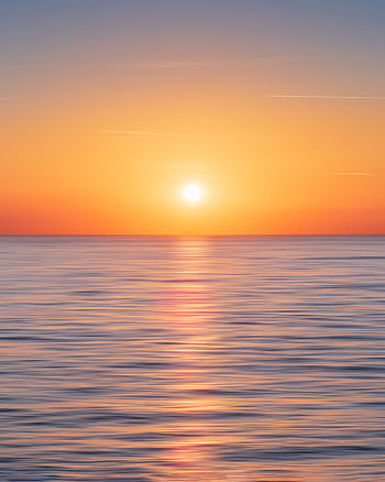 Serene ocean view during sunset in Kadıköy, Istanbul, showcasing a beautiful horizon and calm waters. HD phone wallpaper