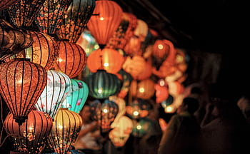Colorful lanterns illuminating the night at a traditional festival celebration. HD wallpaper