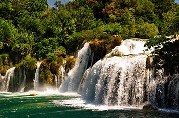 Beautiful cascading waterfalls surrounded by lush greenery in a serene Croatian forest setting. HD wallpaper