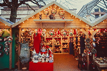 Charming Christmas market stall filled with decorations and festive cheer. HD wallpaper
