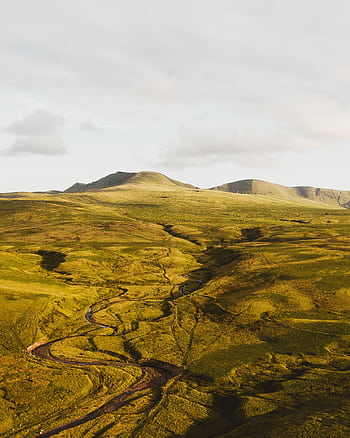 Explore the serene beauty of rolling hills and vast landscapes, ideal for nature lovers. HD phone wallpaper