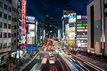 Explore the dynamic night cityscape of Shinjuku, Tokyo, showcasing bright lights and bustling streets. HD wallpaper