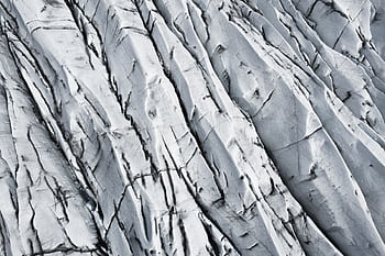 Detailed close-up of Icelandic glacier showcasing natural ice patterns and textures. HD wallpaper