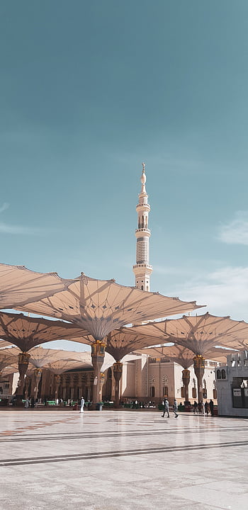 View of the Prophet's Mosque courtyard in Medina, capturing the architectural beauty under a clear sky. HD phone wallpaper