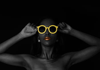 Artistic portrait of a woman wearing yellow sunglasses with gold lipstick accent. HD wallpaper