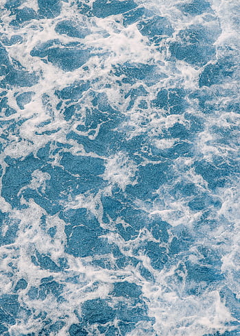 Captivating aerial view of powerful ocean waves creating a serene and endless marine landscape. HD phone wallpaper