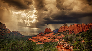 Storm clouds over the red rocks of Sedona, Arizona . HD wallpaper