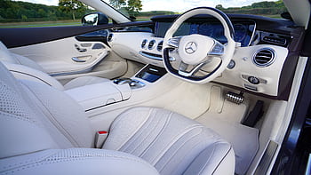 Explore the luxurious interior design of a white Mercedes car showcasing modern automotive elegance. HD wallpaper