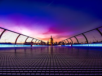 Captivating view of London's Millennium Bridge at sunset with St. Paul's Cathedral in the background. HD wallpaper