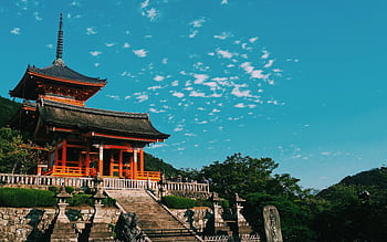 Beautiful view of Kiyomizu Dera Temple in Kyoto, showcasing traditional Japanese architecture under a vibrant sky. HD wallpaper