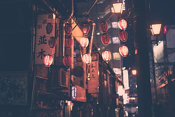 Moody night street with red lanterns in Tokyo Japan, capturing urban charm and cultural essence. HD wallpaper