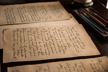 Authentic vintage handwritten letters on a rustic table with pens. HD wallpaper