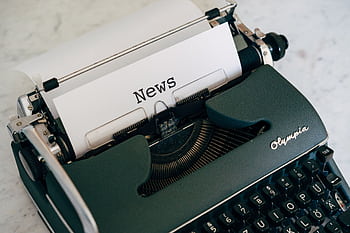 Close-up of an antique typewriter with 'News' on paper. HD wallpaper