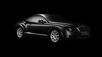 Black luxury car graphed in studio with sleek design and chrome accents. HD wallpaper