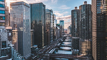 A breathtaking view of Chicago's iconic skyscrapers and waterway at day with a clear sky. HD wallpaper