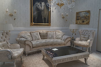 A sophisticated and luxurious living room interior featuring classic furniture and elegant decor. HD wallpaper