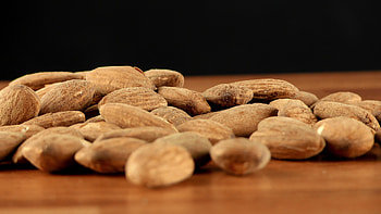 Wooden background almonds, Stock video charm, Almond's rustic appeal, Natural beauty captured HD wallpaper