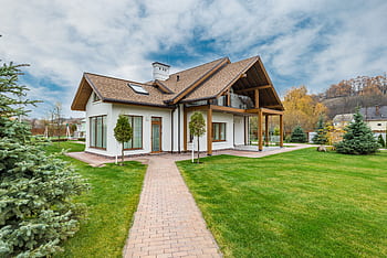 Contemporary house with a beautiful exterior and spacious lawn, set in a suburban area. HD wallpaper
