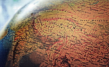 Explore the intricate details of China and neighboring regions in this vintage-style globe . HD wallpaper