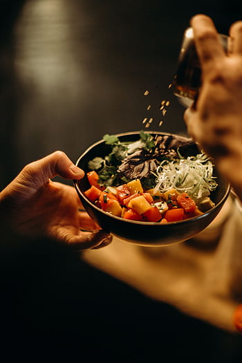 A delicious bowl of Asian salad with fresh vegetables and sesame seeds, perfect for a healthy meal. HD phone wallpaper