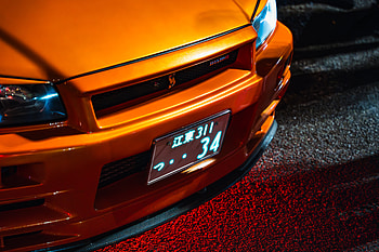Ultra of Orange Nissan Skyline GT-R R34 Front View, vehicle, Nissan, Nissan Skyline GT-R R34, orange car HD wallpaper