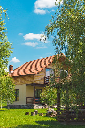 Discover a que rustic house surrounded by vibrant greenery in a serene summer landscape. HD phone wallpaper