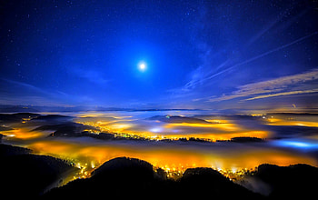 FOG COVERED CITY, night, fog, city lights, hills, moon, sky, stars HD wallpaper
