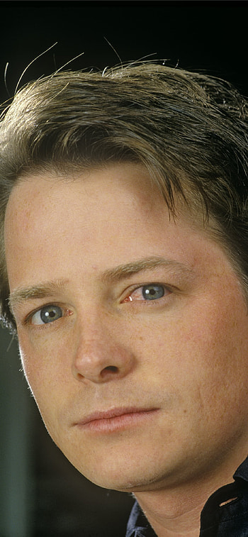 Michael J. Fox, Movies icon, Charismatic performer, Endearing presence HD phone wallpaper