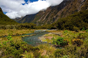 Mountain creek, blue, river, creek, peaks, peaceful, nice, calm, hills, slopes, bushes, beautiful, grass, mountain, summer, clouds, nature, sky, lovely, calmness, stream HD wallpaper