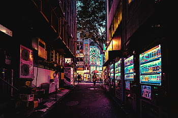Explore a neon-lit alleyway in Tokyo, showcasing vibrant city life and bustling urban vibes. HD wallpaper