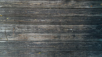 Close-up of rustic wooden planks with natural wood grain texture, perfect for backgrounds or design projects. HD wallpaper