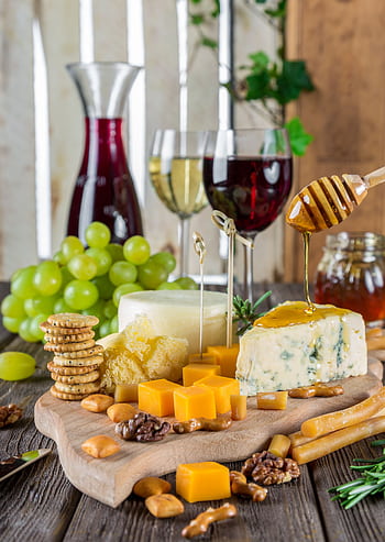 Sophisticated cheese platter with assorted wines, grapes, honey, and nuts. HD phone wallpaper