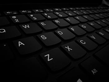 Dramatic close-up of a black computer keyboard showing detail of keys. HD wallpaper