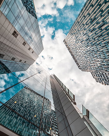 Low angle view of modern skyscrapers reflecting the cloudy sky in Brussels, Belgium. HD phone wallpaper