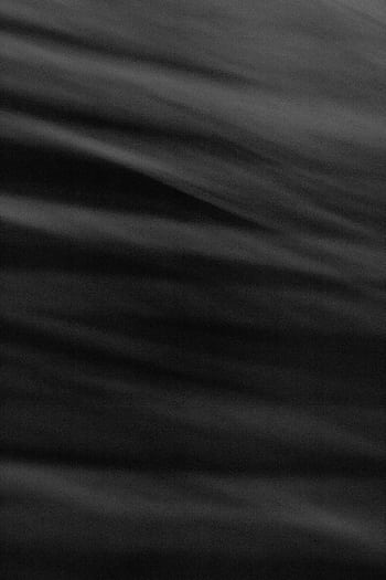 Dark abstract black wave texture with a smooth flowing pattern, ideal for backgrounds. HD phone wallpaper