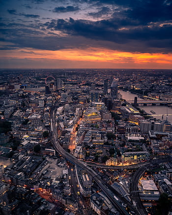 Captivating aerial view of London at twilight with city lights and skyline. HD phone wallpaper