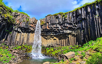 Svartifoss, Iceland, river, plants, clouds, sky, water, cliff, rocks, stones HD wallpaper