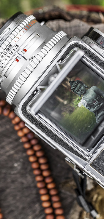 A vintage Hasselblad camera with a of a buddha statue on it., man made, camera HD phone wallpaper