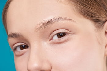 A close-up showcasing a woman's natural skin and eye detail, emphasizing natural beauty. HD wallpaper