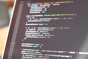 Close-up view of colorful code on a laptop screen, showcasing programming concepts. HD wallpaper