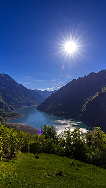 Mountains in Switzerland, Switzerland, lake, sun, mountain, nature, landscape HD phone wallpaper