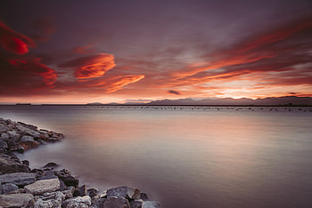 Rocks Near Body Of Water During Sunset, rocks, nature, sunset, water HD wallpaper