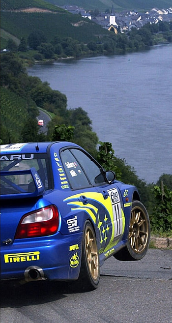 Subaru impreza wrc, car, wheel HD phone wallpaper