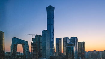 Stunning view of Beijing's skyline with iconic skyscrapers at sunset. HD wallpaper