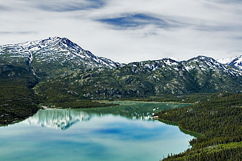 Peaceful Mountain Lake, blue, snow, clouds, mountains, lake, vegetation HD wallpaper