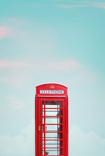 Minimalist of a red tele booth in London with a clear blue sky. HD phone wallpaper