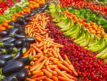 Vibrant selection of fresh fruits and vegetables on a market stall. Healthy eating and organic living. HD wallpaper